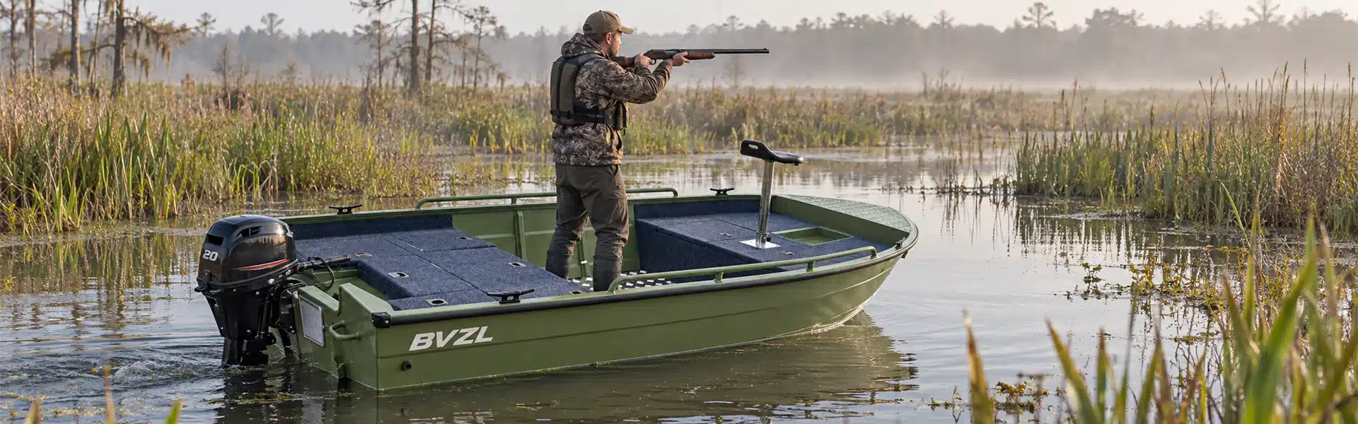 Aluminum Jon Boat with outboard engine in a marsh hunting scene